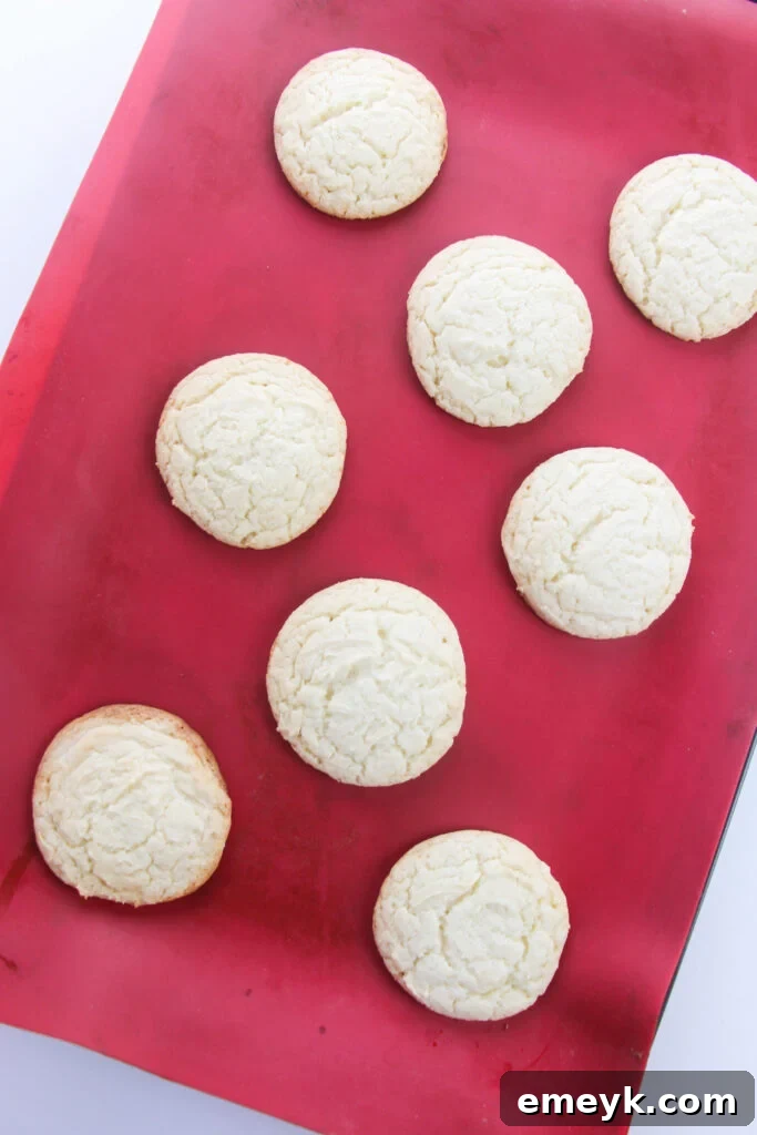 Baked Easy Cake Mix Sugar Cookies cooling on a silicone mat