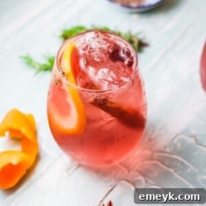 Cranberry Wine Spritzer in a glass, ready to be enjoyed.