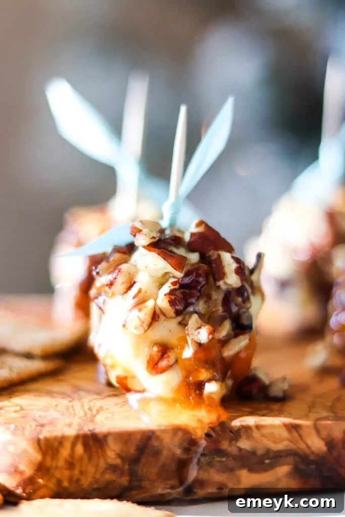 Honey Goat Cheese Balls arranged beautifully on a wooden board, showcasing their texture.