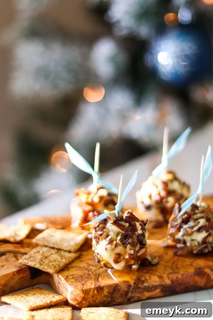 Close-up of Honey Goat Cheese Balls with toothpicks, ready to be served on a platter.