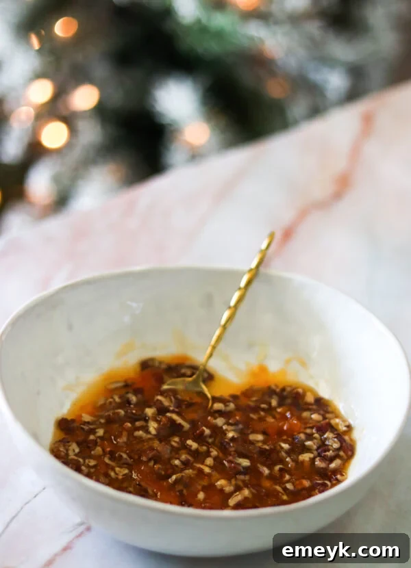 Close-up of the honey, apricot, and pecan mixture in a bowl, ready for coating.