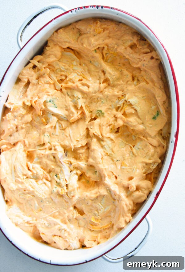 Buffalo chicken dip mixture spread evenly in a 2-quart baking dish