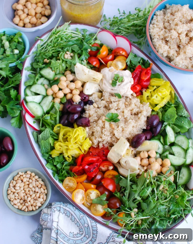 Greek Quinoa Bowl Recipe ingredients on a platter