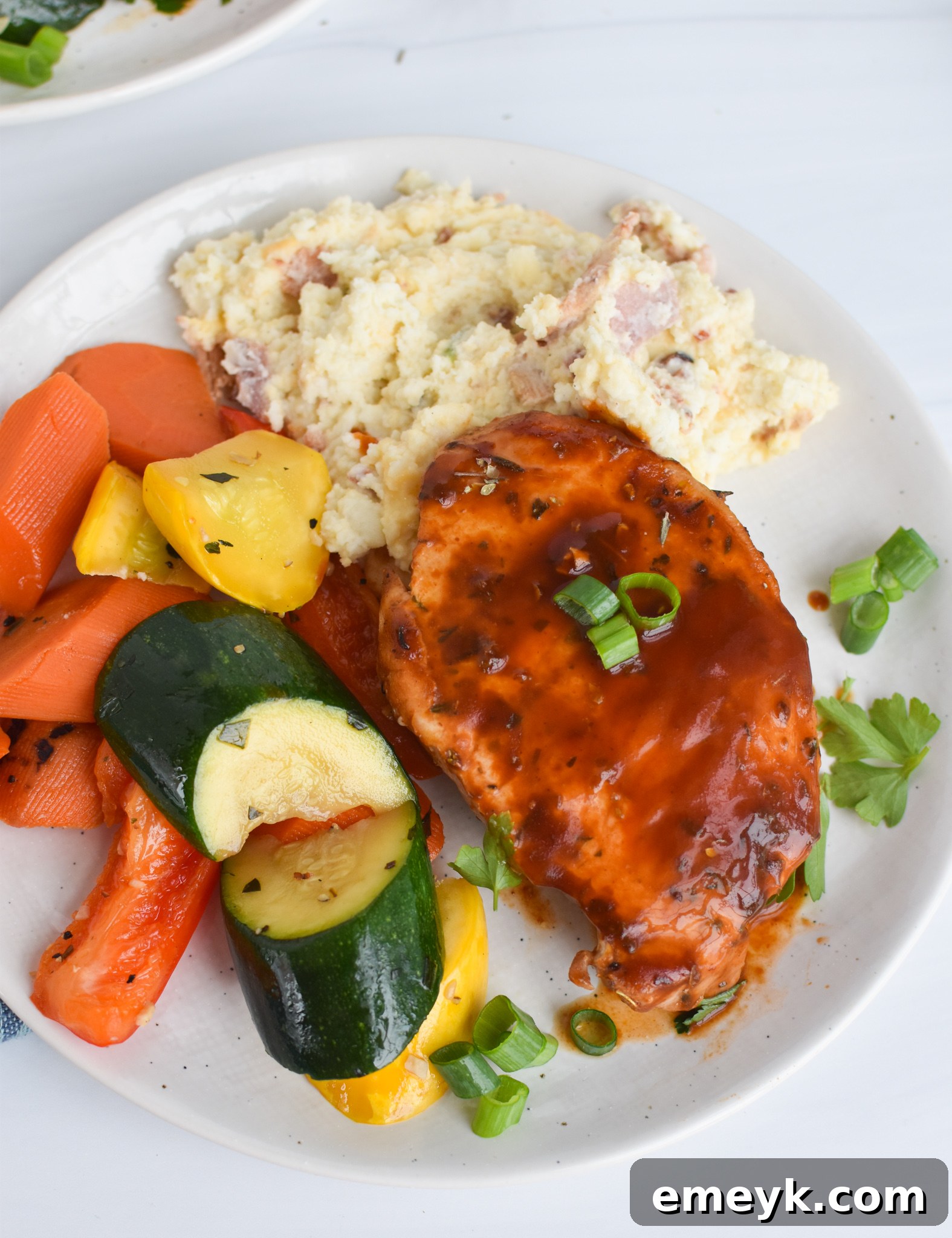 Succulent Baked BBQ Pork Chops 9 Platter of BBQ Baked Pork Chops served with mashed potatoes and green beans.
