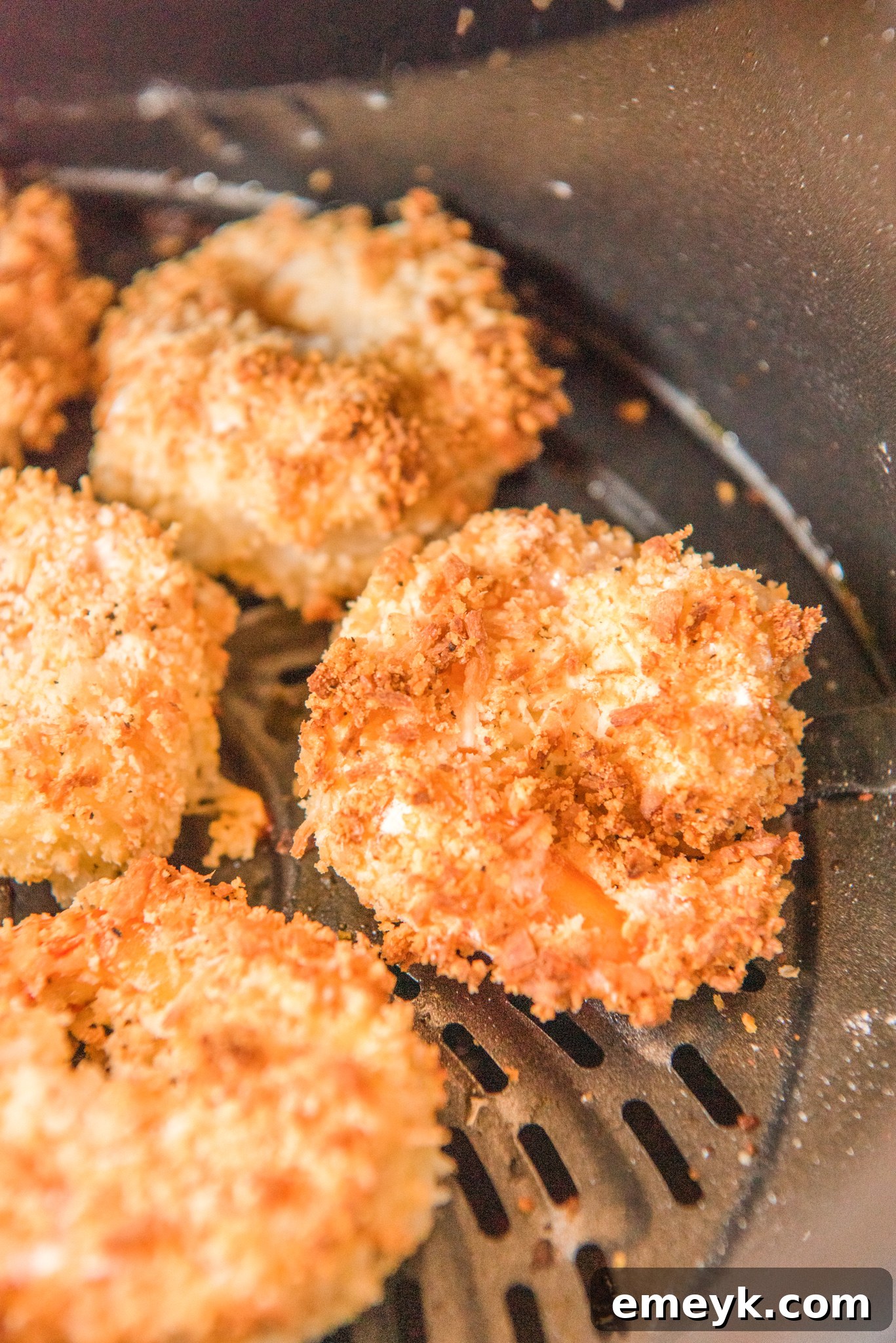 Air Fryer Coconut Shrimp cooked to perfection, ready to be served from the air fryer.
