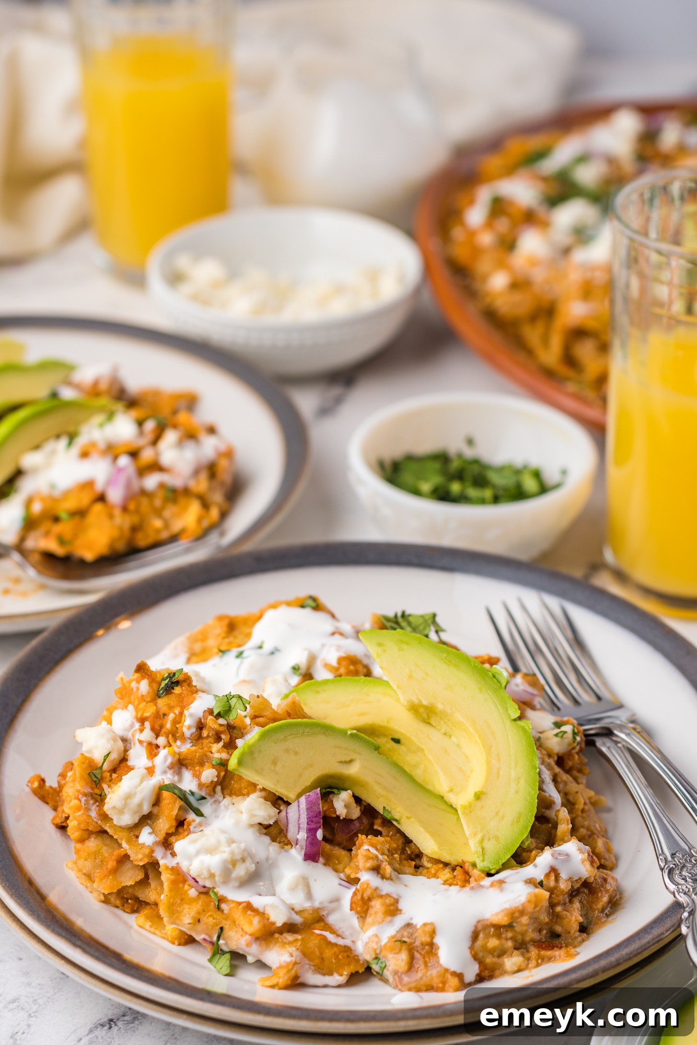 Chilaquiles Rojos on a plate with fork.
