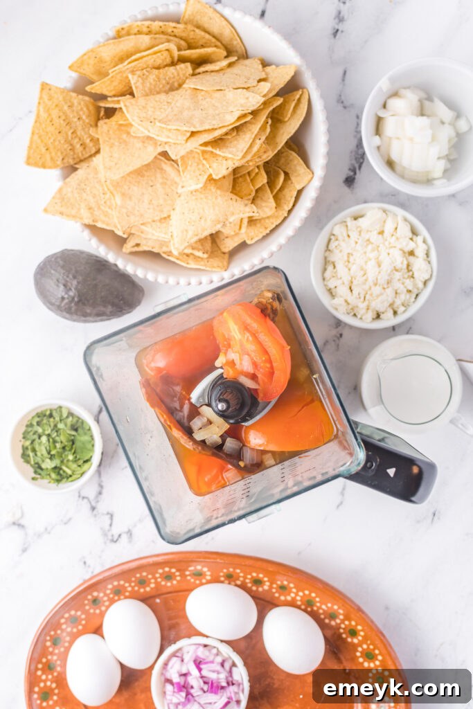 Chilaquiles Rojos Recipe with the sauce ingredients in a blender.