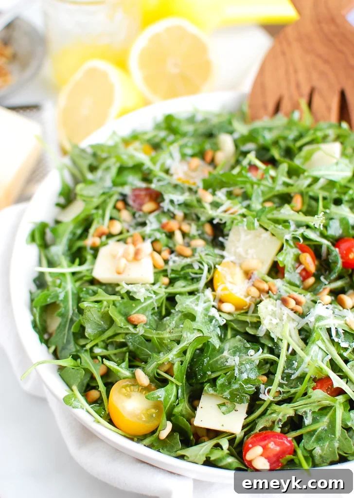 17 Effortless Sides to Elevate Your Fish Meal 4 Fresh Lemon Arugula Salad with Pine Nuts and cherry tomatoes.