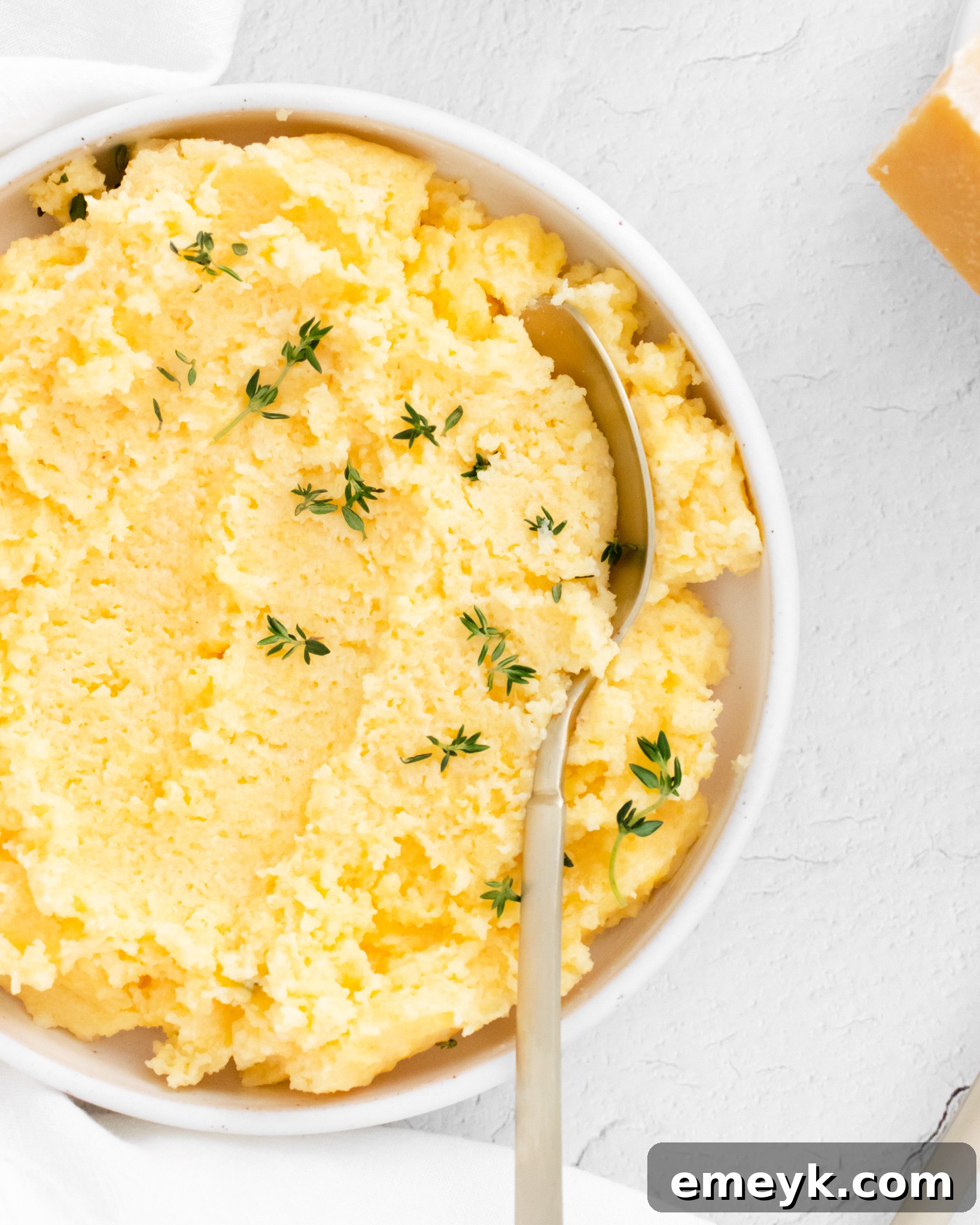 Creamy Polenta Recipe with a spoon.