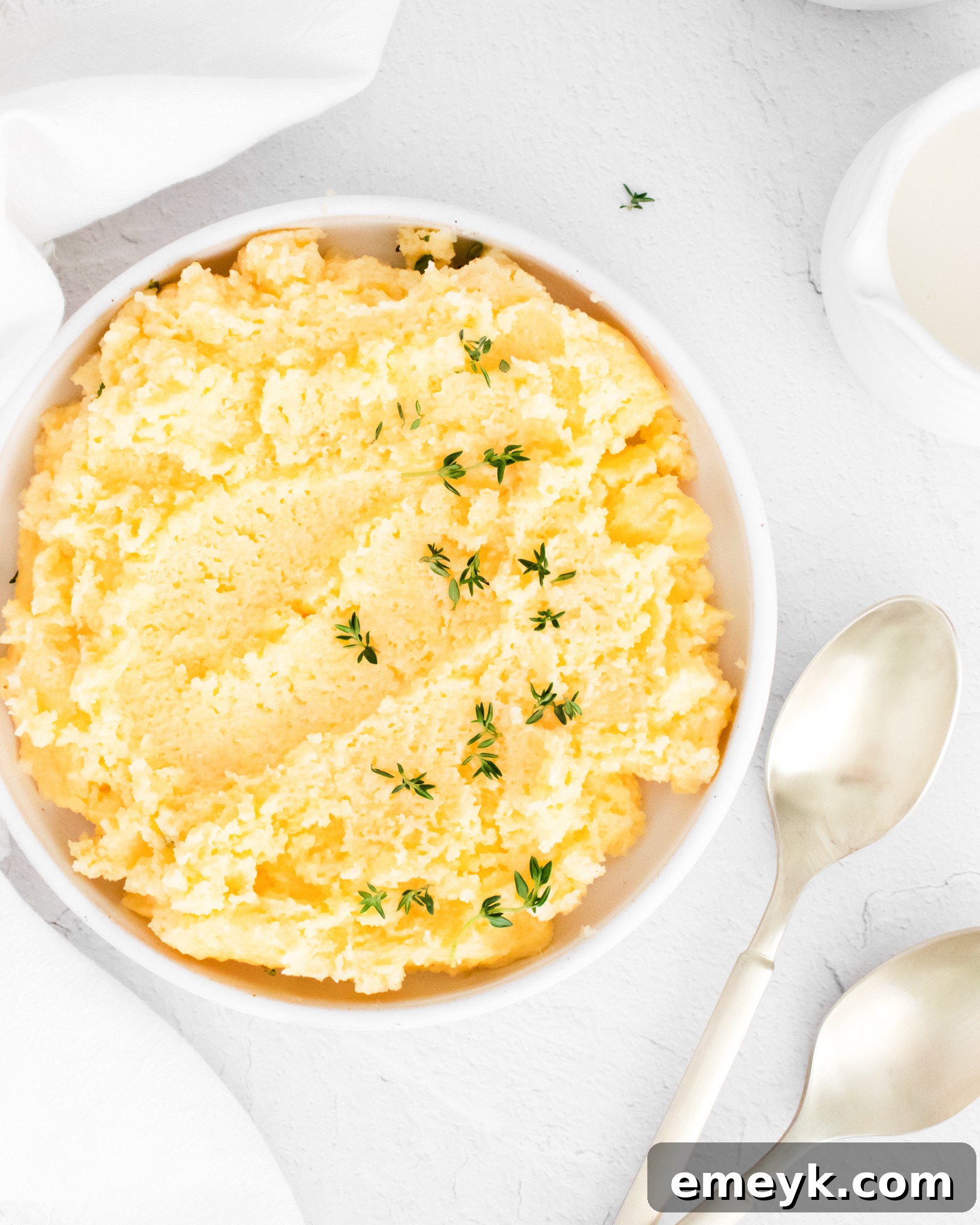 Creamy Polenta Recipe with spoons.