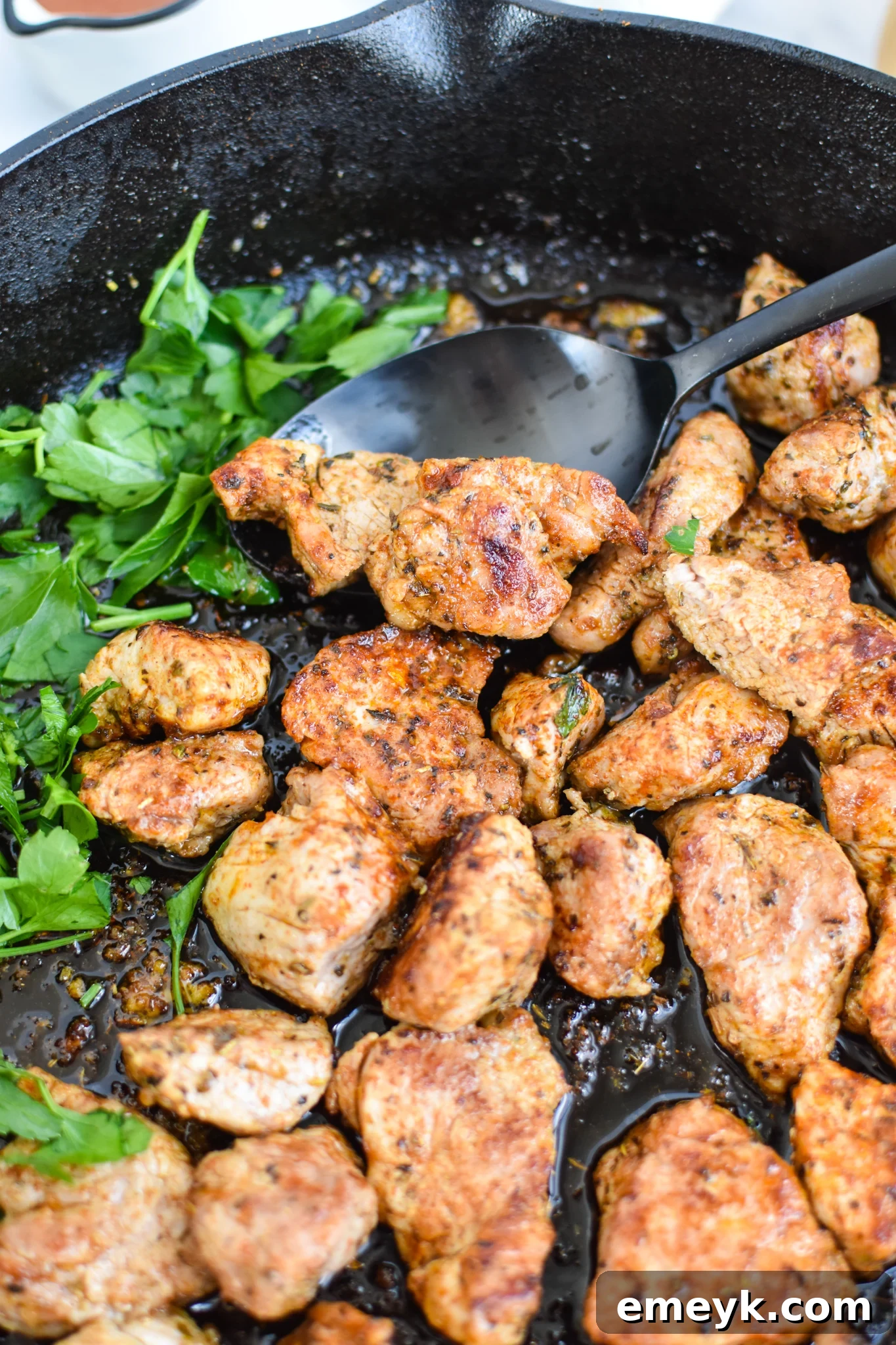 Perfectly Seared Cast Iron Pork Tenderloin in a skillet, ready to be served.