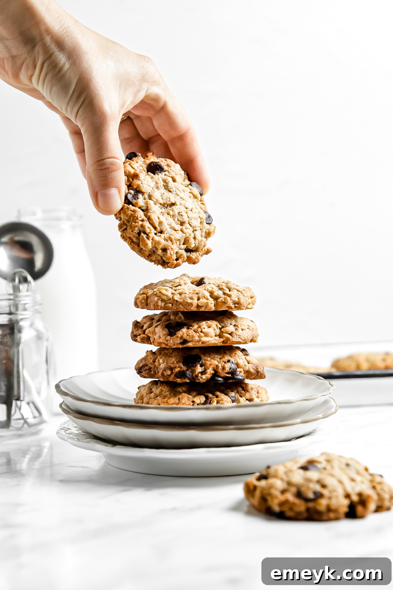 Banana Bliss Oatmeal Cookies 9 A stack of golden brown Homemade Banana Oatmeal Cookies, perfectly baked and ready to be enjoyed.