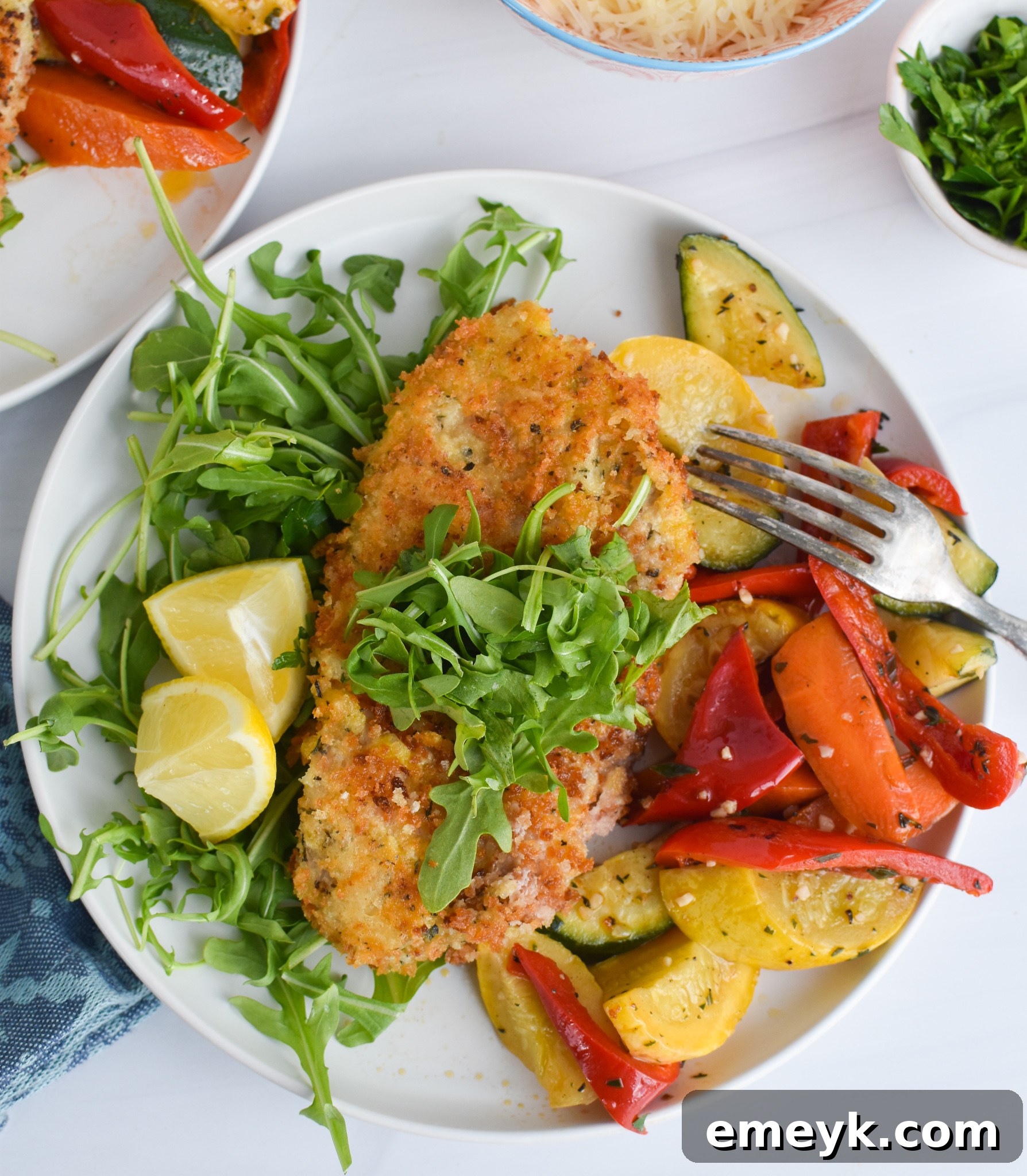Crispy golden-brown Veal Milanese resting on a plate, ready to be served.