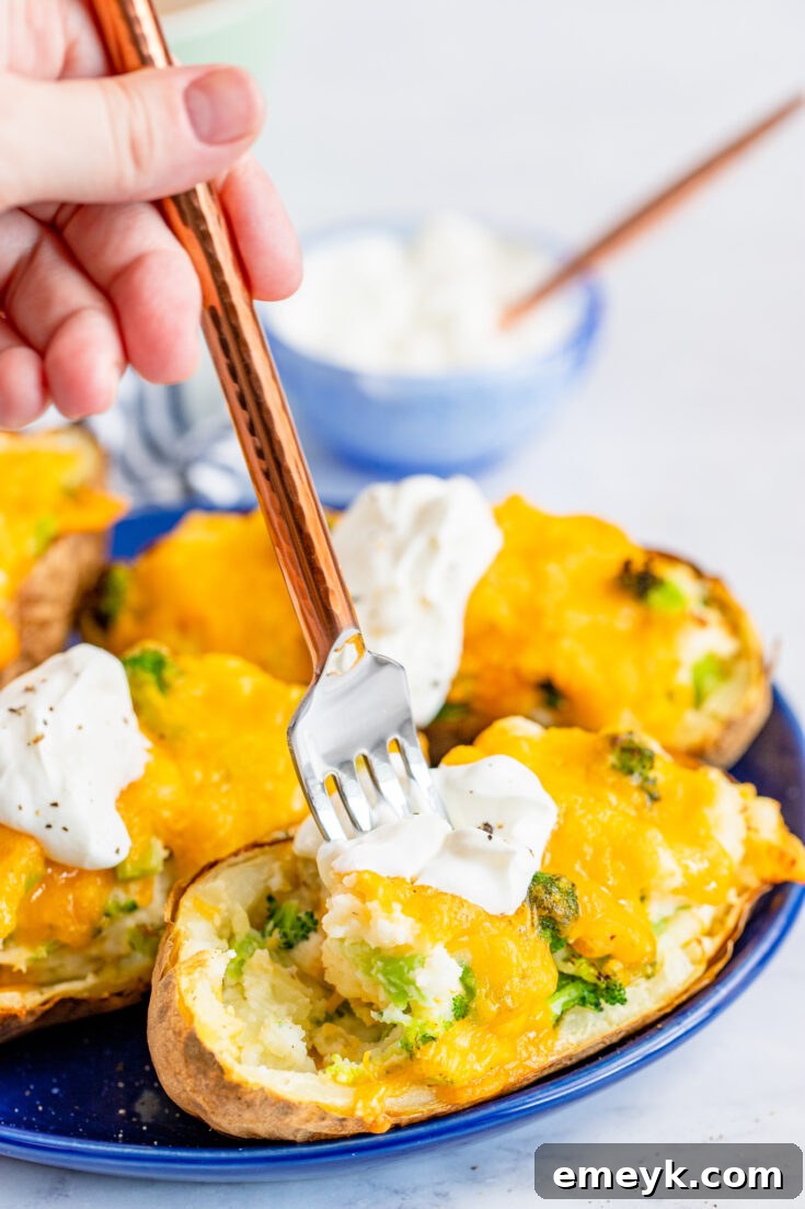 Air Fryer Twice Baked Potato, stuffed with fluffy mashed potatoes, broccoli, and cheese.