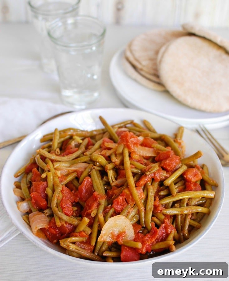Warm and spiced Lebanese Green Beans with tomatoes, cinnamon, and cumin.