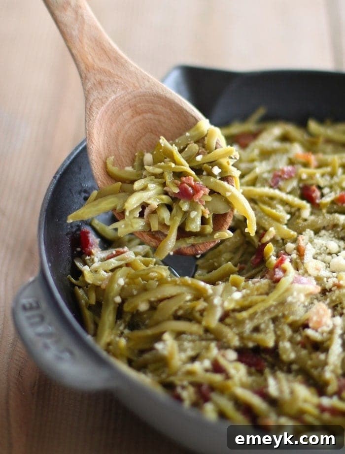 Quick and easy Firehouse Green Beans with Bacon, garlic, and Parmesan.
