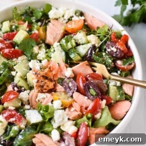 Mediterranean Salmon Bowl in a white bowl with a gold fork