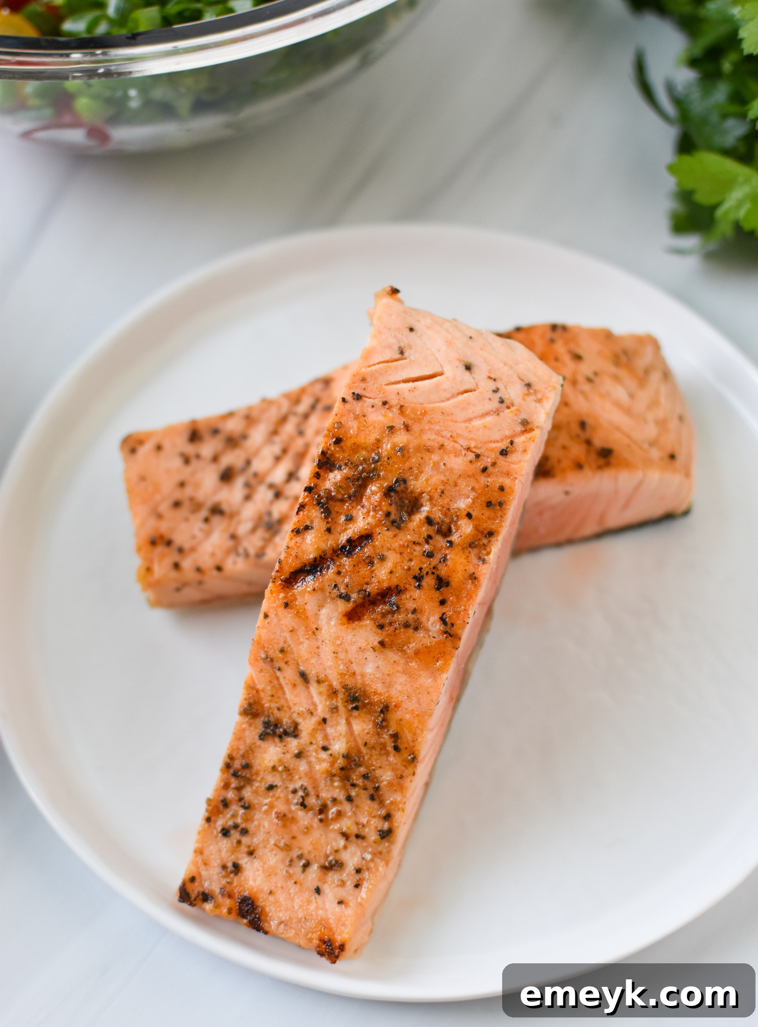 Sun-Drenched Mediterranean Salmon Bowl 5 Close-up of perfectly baked and flaked lemon-dill salmon, ready to be added to the Mediterranean Salmon Bowl.