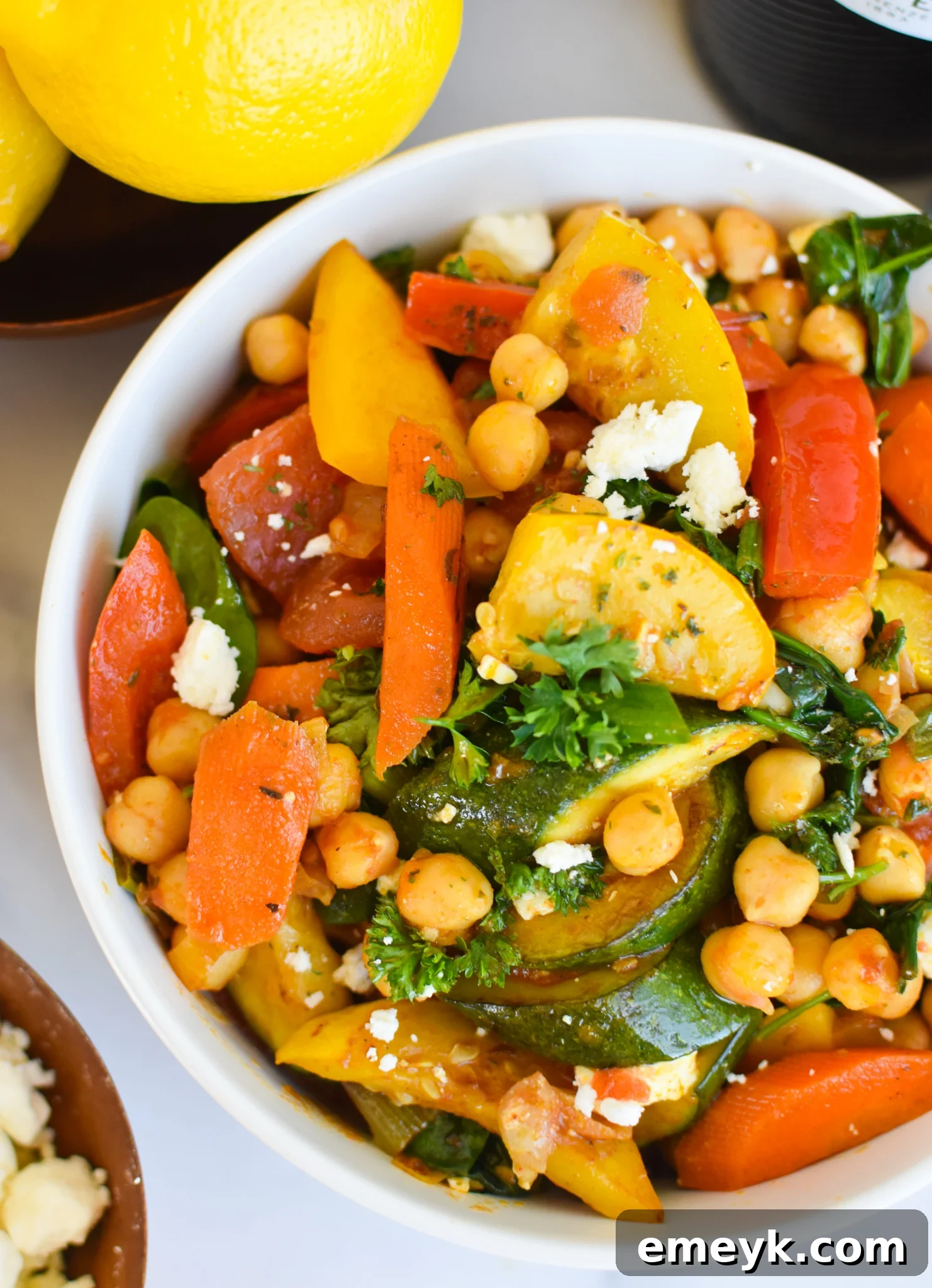 Vibrant Mediterranean Chickpea Skillet 4 A serving of Mediterranean Chickpea Skillet in a rustic bowl, ready to be enjoyed.