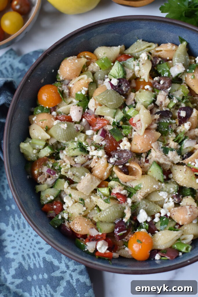 Mediterranean Tuna Pasta Salad in a blue serving bowl, ready to be enjoyed.