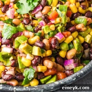 Cowboy Caviar Recipe in a serving bowl, garnished with fresh cilantro.
