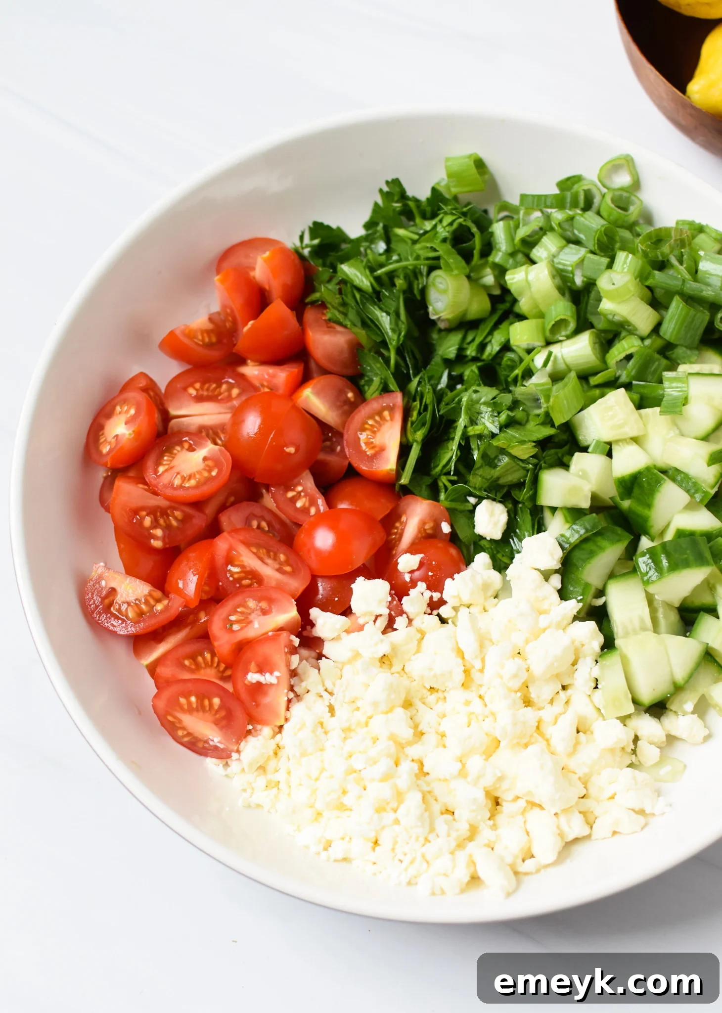 Ingredients for a vibrant Mediterranean salad for pairing with chicken.