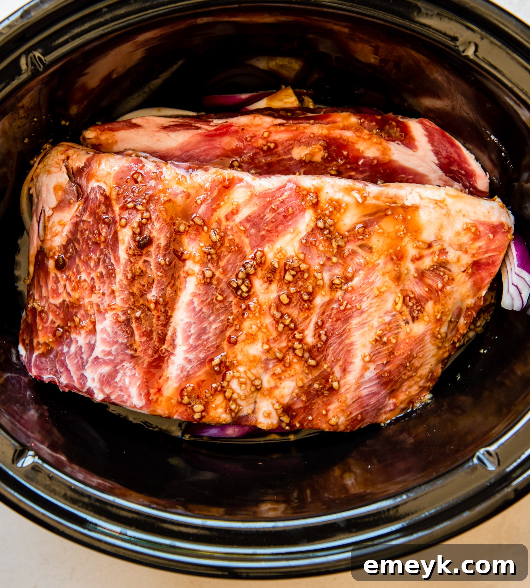 Cooked Slow Cooker Hawaiian Pork Ribs in the crockpot, ready to be served.