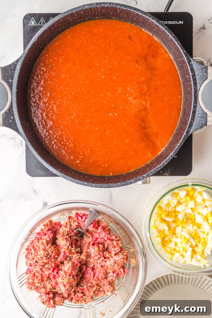 Chipotle sauce simmering in a pot.