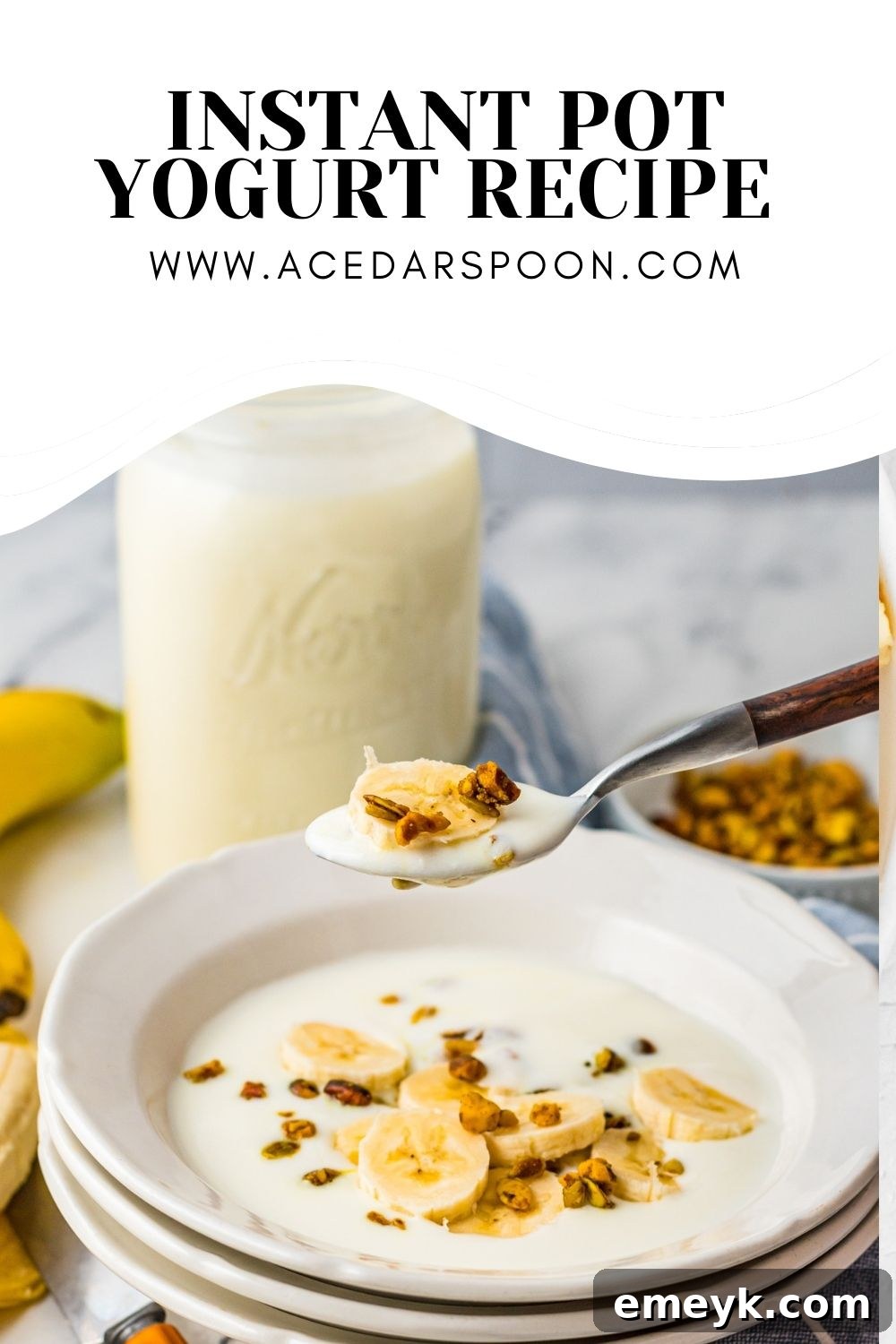 A close-up shot of a spoon scooping homemade Instant Pot Yogurt with granola and berries.
