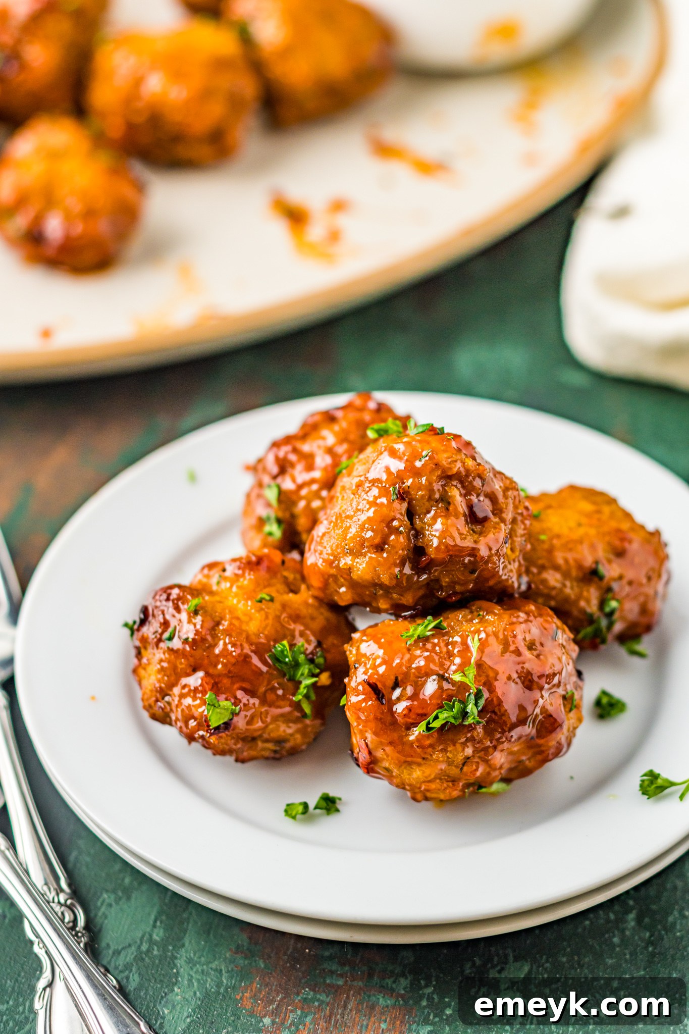Perfectly cooked Air Fryer Meatballs arranged on a serving plate.