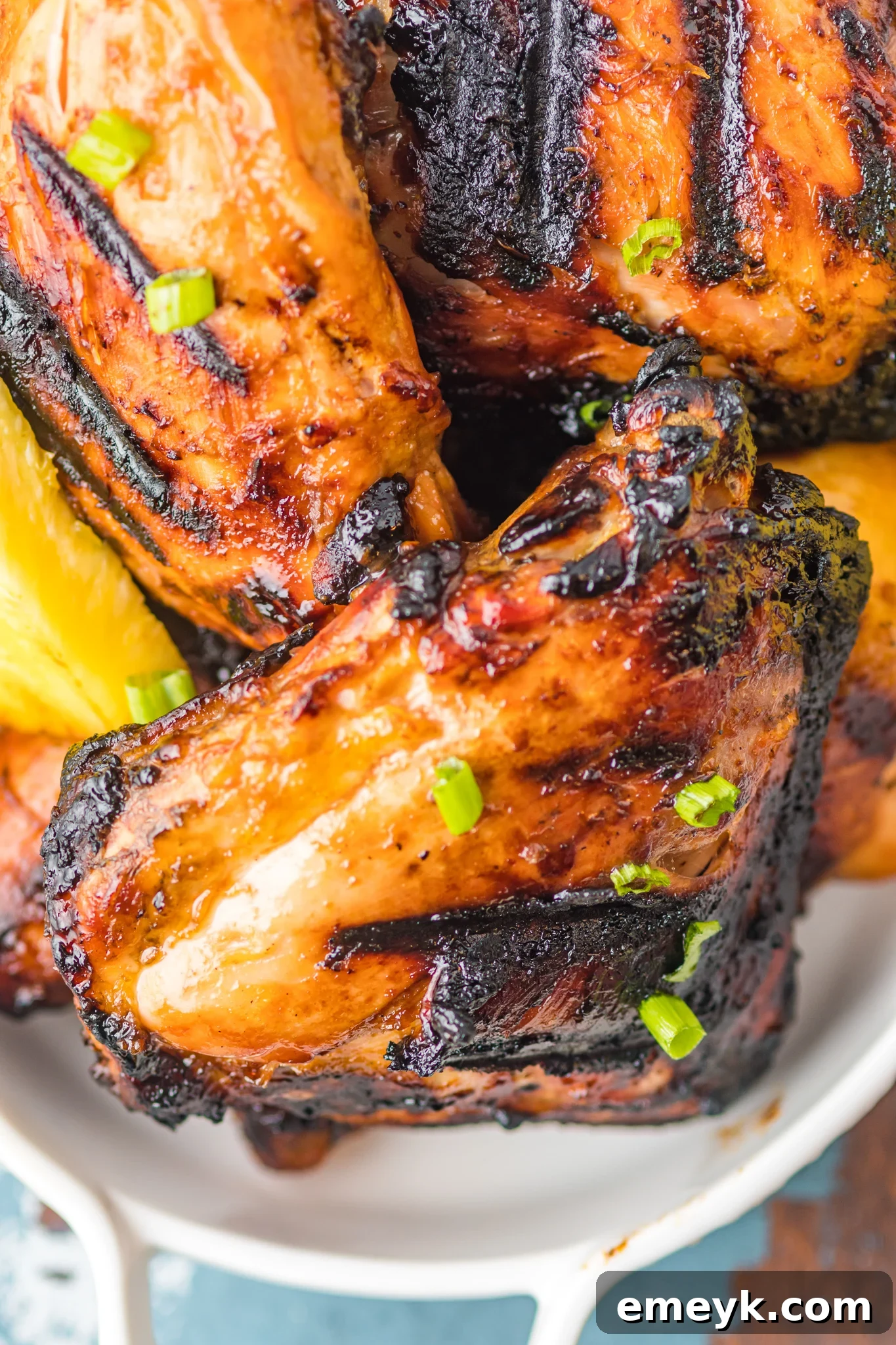 Golden Glazed Huli Huli Chicken 4 A large platter of beautifully grilled Huli Huli Chicken, glistening with sauce and ready to serve.