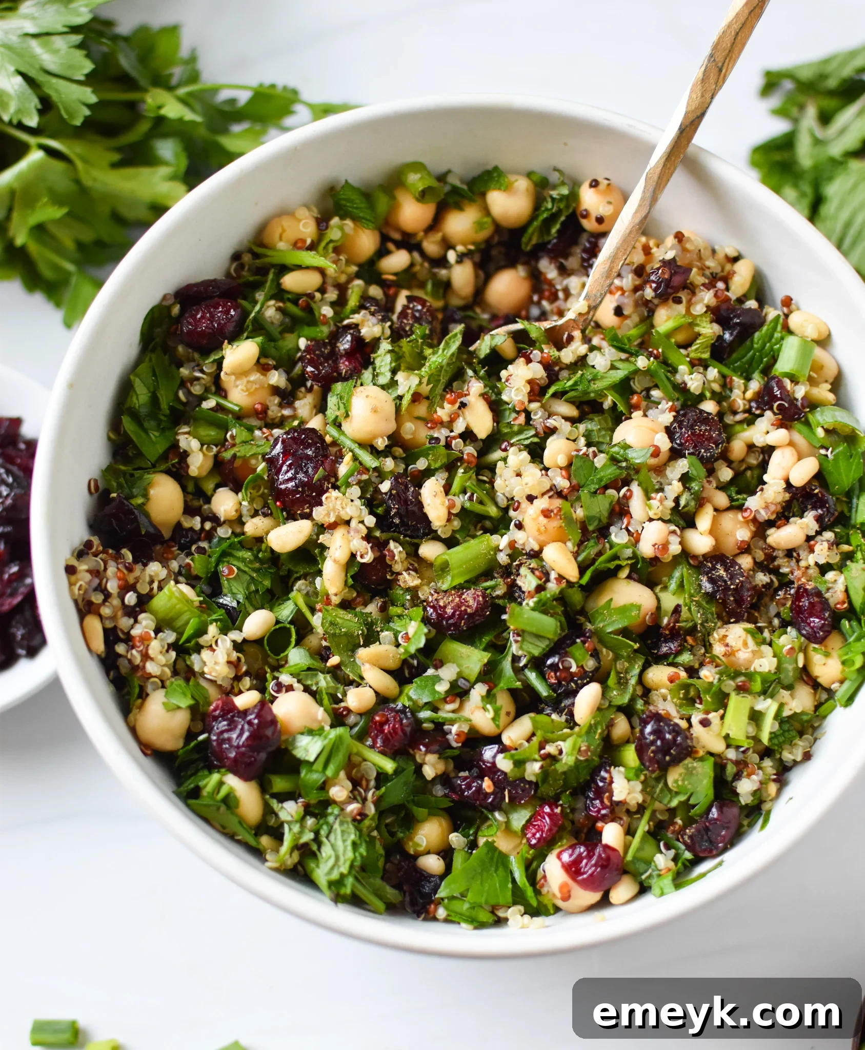 Mediterranean quinoa salad in a bowl, ready to be stuffed into squash.