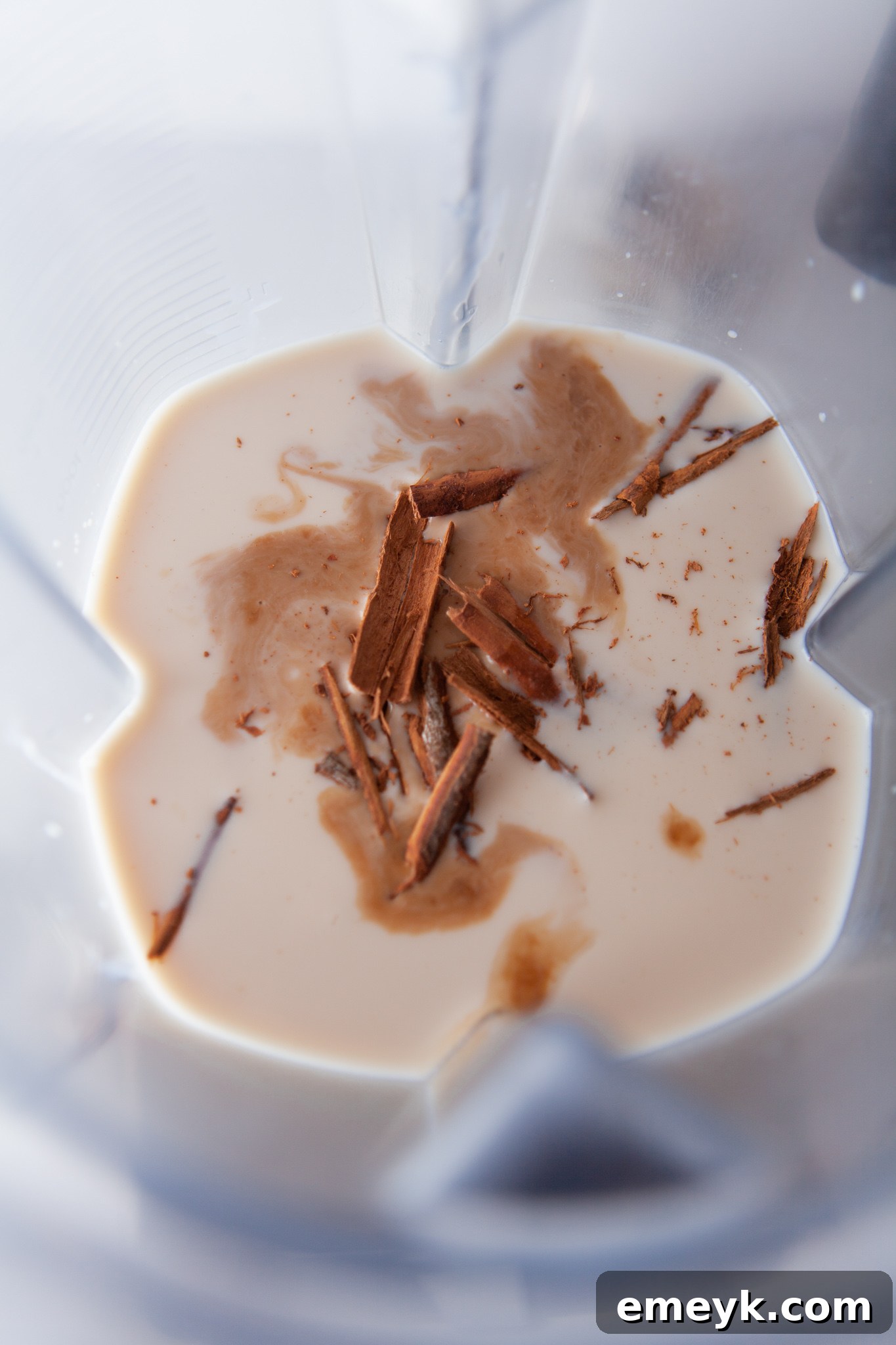 Creamy Homemade Horchata 5 Horchata Recipe ingredients blending in a blender.