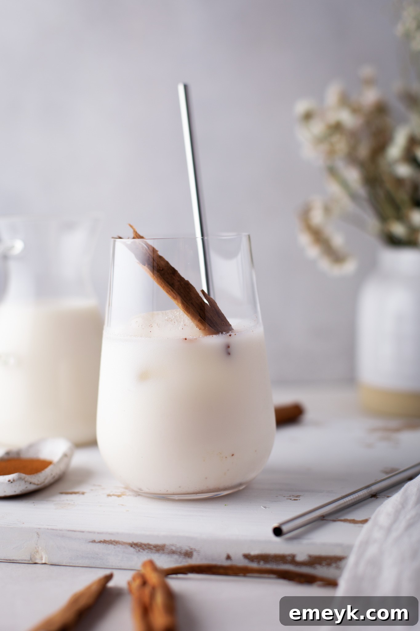 Creamy Homemade Horchata 7 Horchata Recipe with cinnamon sticks and pitcher.