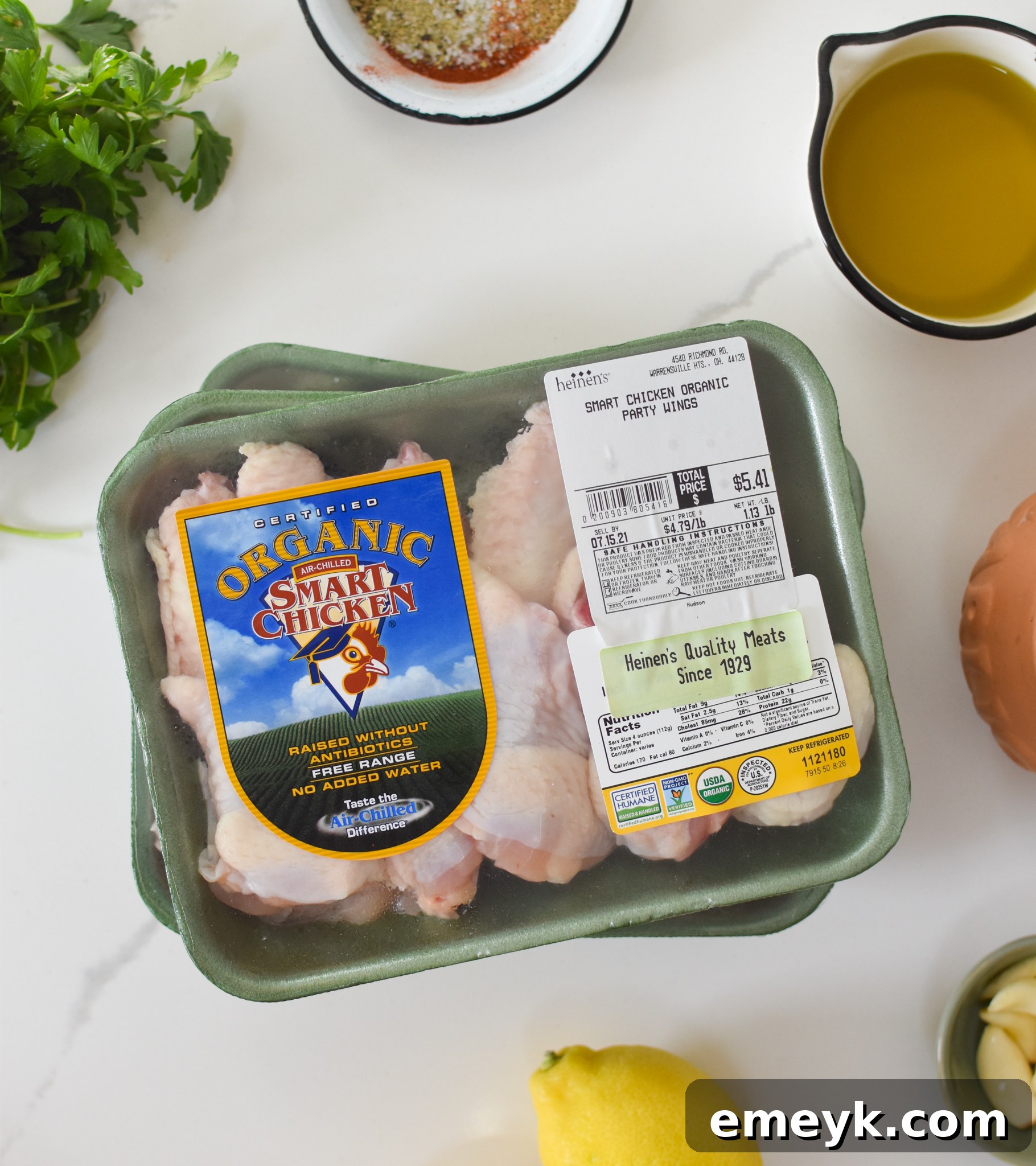 All the fresh ingredients for Grilled Mediterranean Chicken Wings laid out on a table.