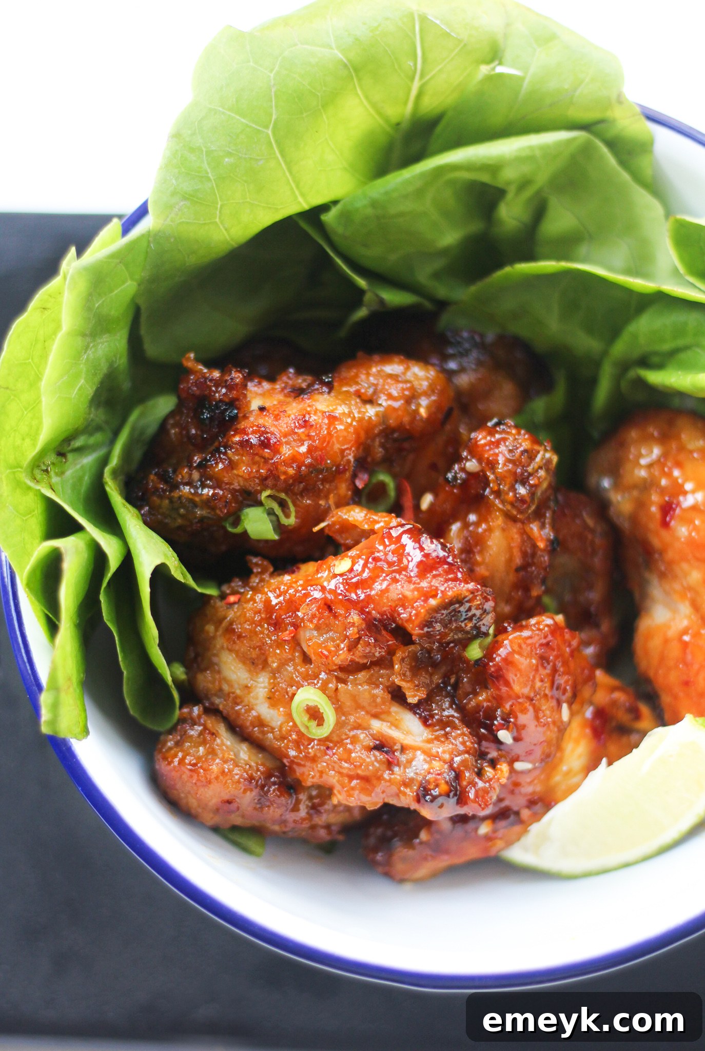 Air Fryer Chicken Wings Recipe finished and garnished with green onions. 