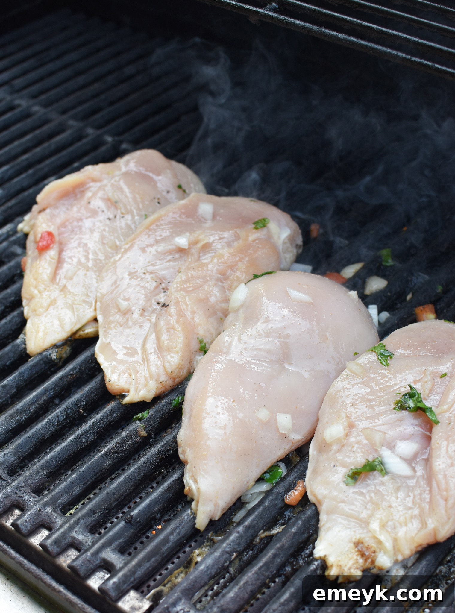 Tequila-Lime Grilled Chicken 6 Margarita Grilled Chicken cooking on an outdoor grill, showing beautiful grill marks.