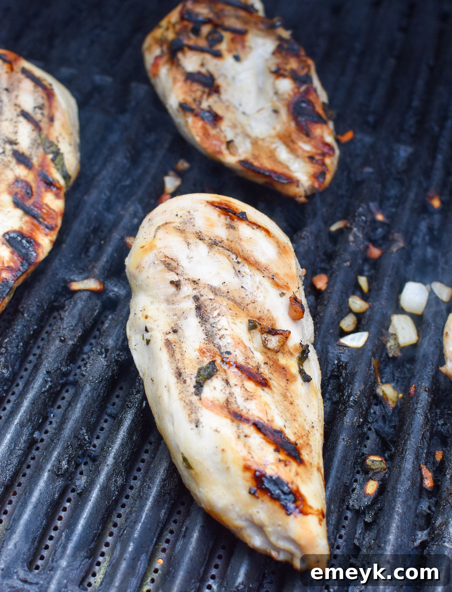 Tequila-Lime Grilled Chicken 7 Close-up of Margarita Grilled Chicken sizzling on the grill, almost ready to be removed.