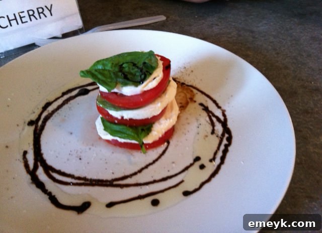 Close-up of fresh Caprese salad with ripe tomatoes, mozzarella, and basil