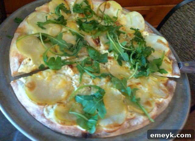 Gourmet potato pizza with arugula and cheese