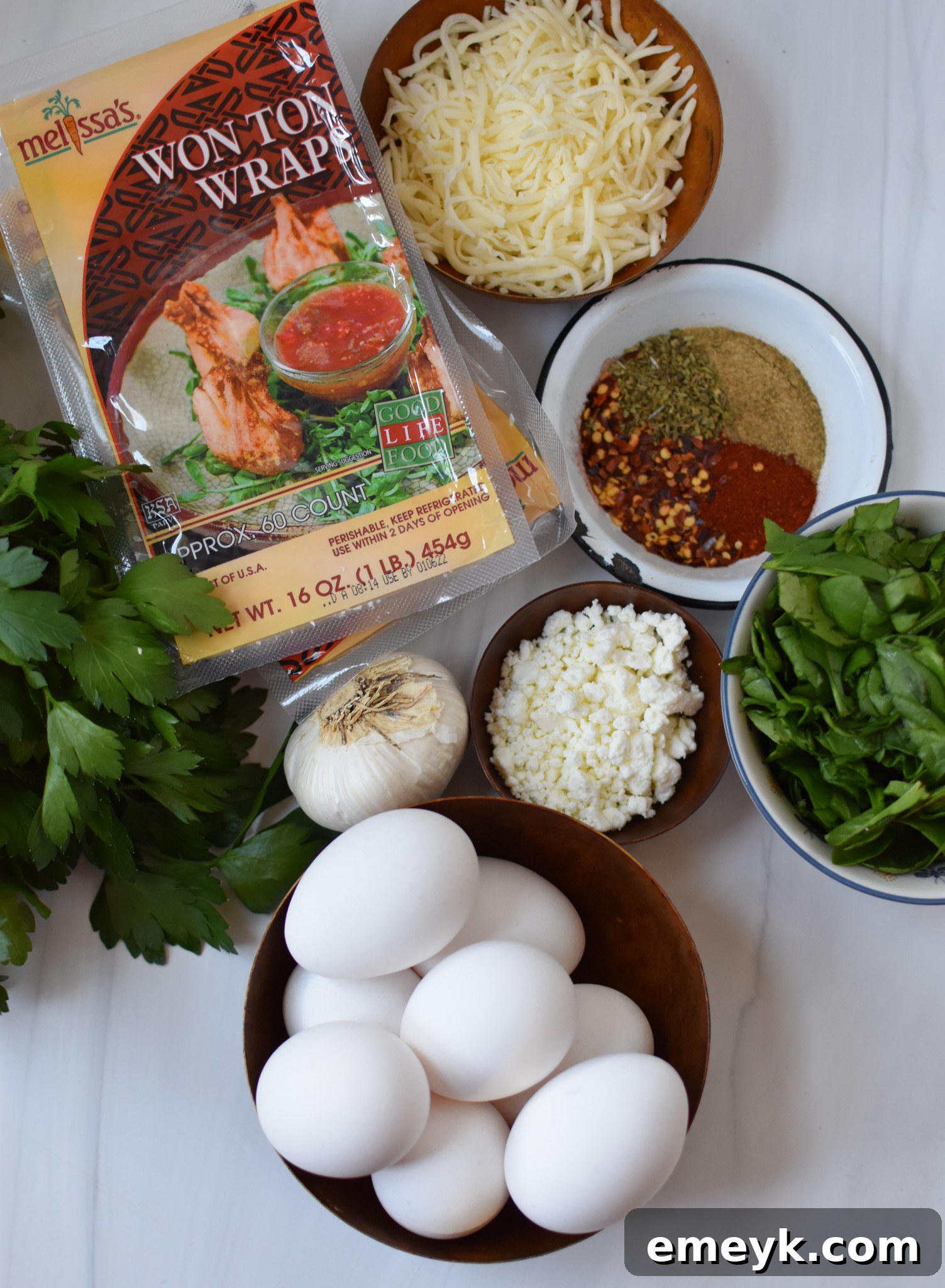 Mediterranean Quiche Pockets 3 All ingredients for Mediterranean Quiche Wontons laid out on a table.