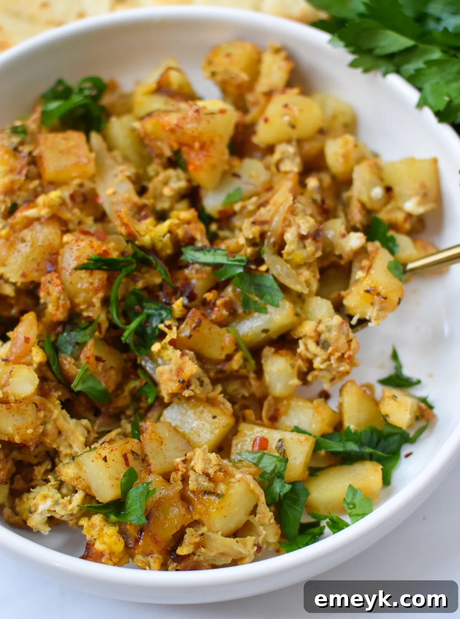 Lebanese Potato and Egg Recipe served in a white bowl, ready to eat.