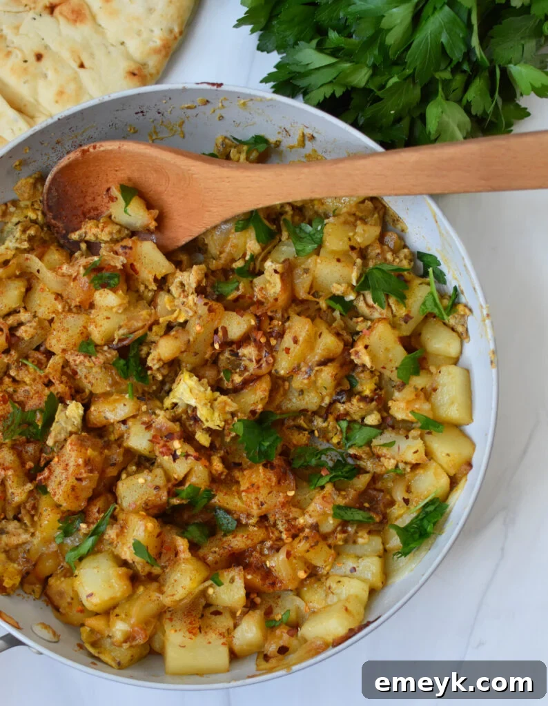 Lebanese Potato and Egg in a skillet, still cooking.