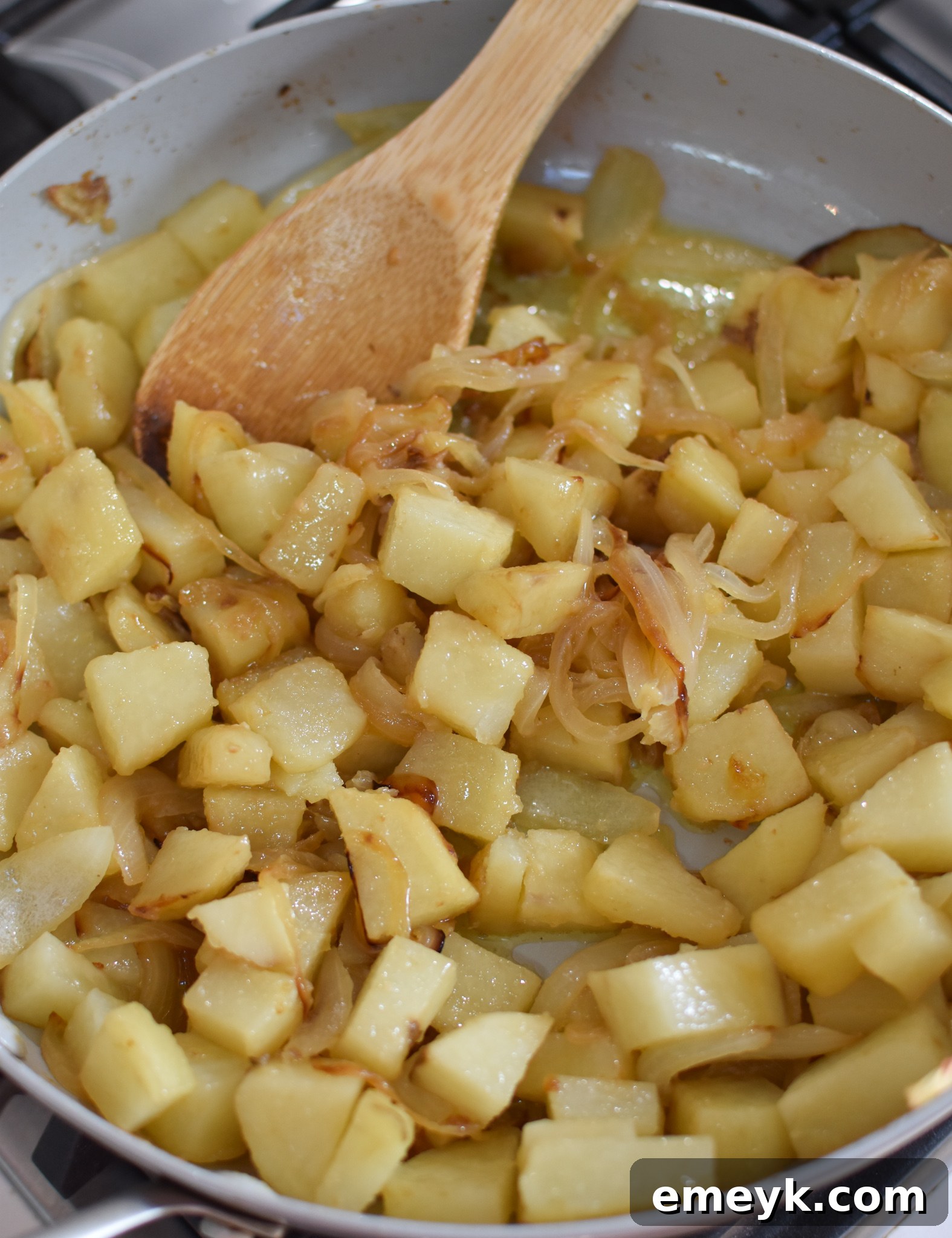 Eggs and spices whisked together in a bowl, ready for the skillet.