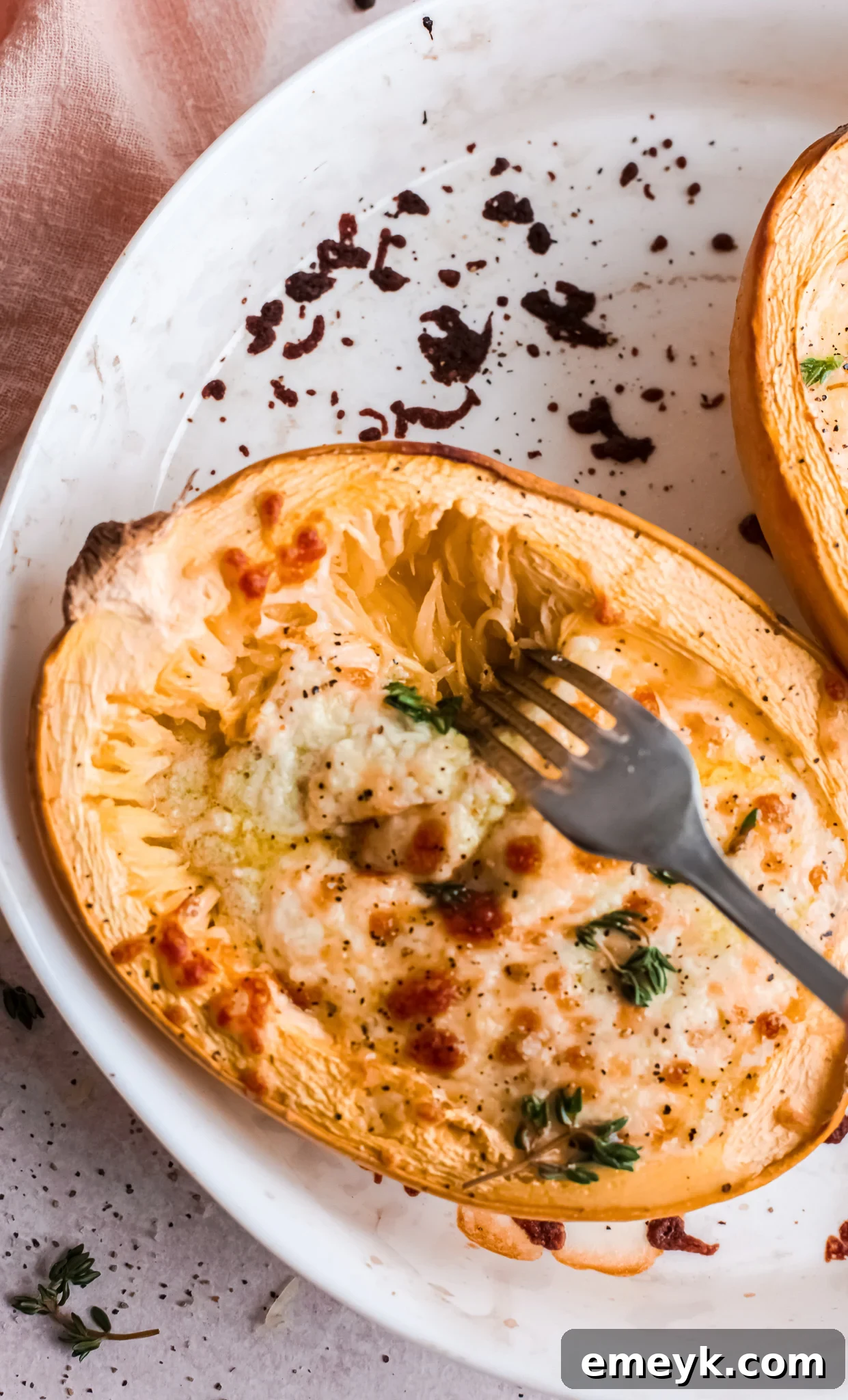 Baked Cheesy Spaghetti Squash Recipe in squash bowl.