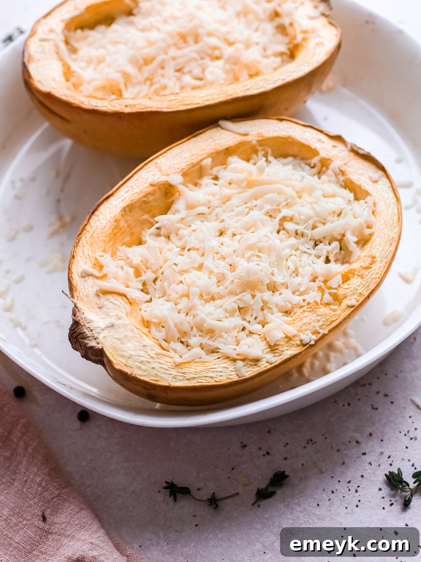 Baked Cheesy Spaghetti Squash Recipe with cheese on top.