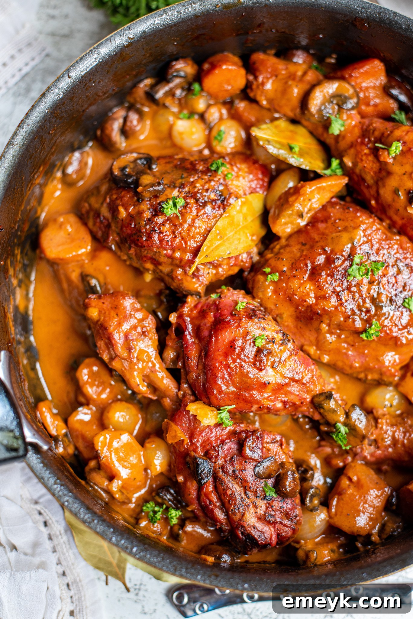 Coq au Vin Recipe garnished with fresh parsley.
