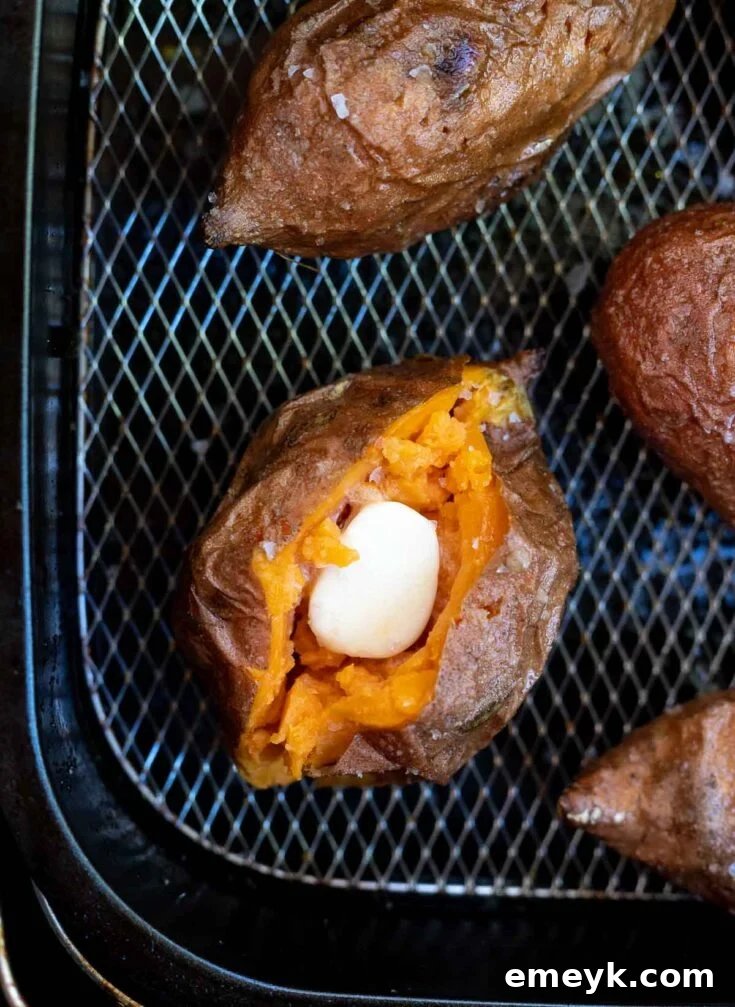 Perfectly cubed Air Fryer Sweet Potato Recipe, roasted until golden and slightly caramelized, seasoned with fresh herbs.