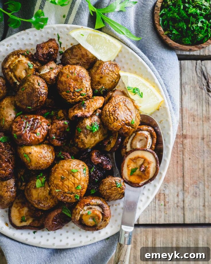 Perfectly cooked Air Fryer Mushrooms, tender and lightly browned, seasoned with fresh thyme and ready to be served as a savory side.