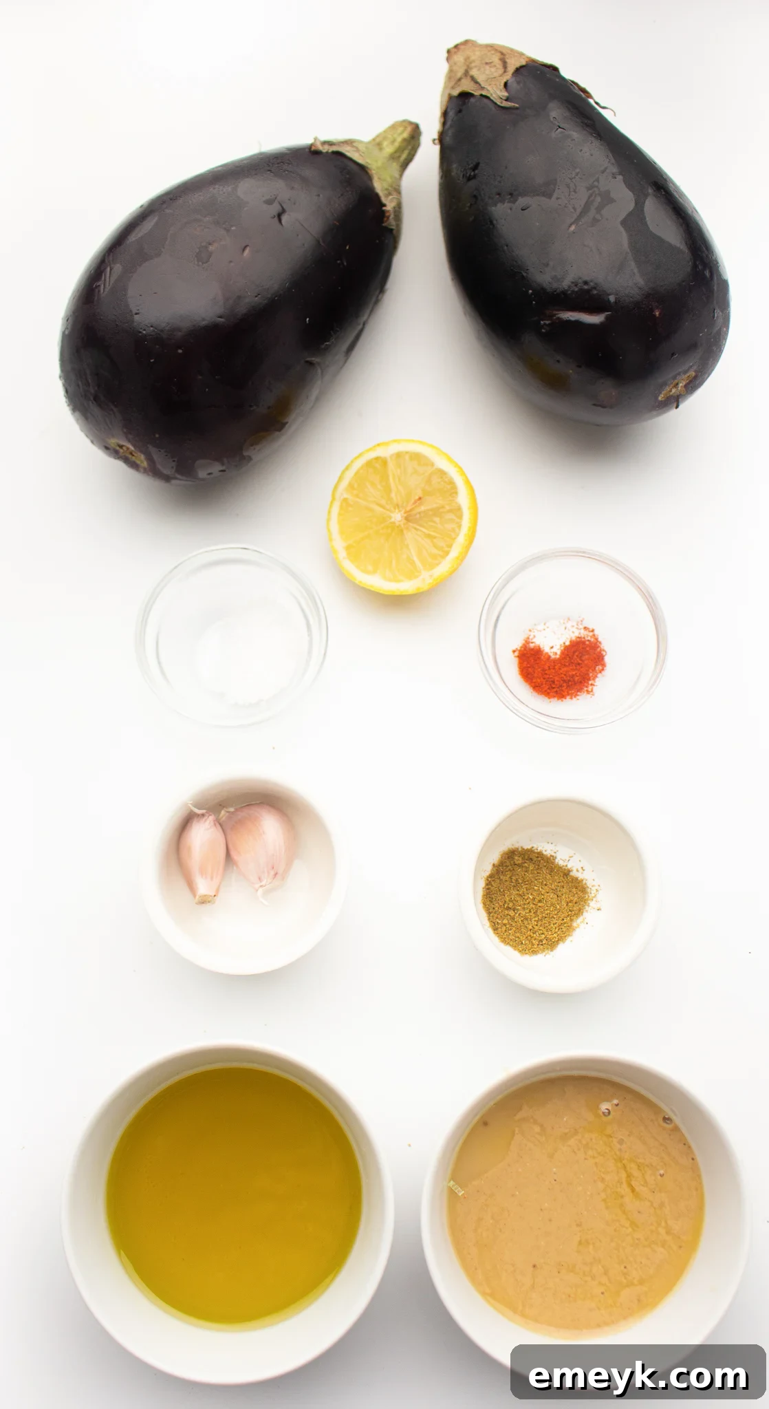 Fresh ingredients laid out for Air Fryer Eggplant: eggplants, olive oil, and spices.